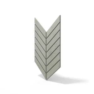 Chevron Betonfliese im Farbton Basil, verlegt im Fischgrätmuster. Die Fliese ist Teil der VHCT-Kollektion und bietet eine moderne Wandgestaltung für Innenräume.